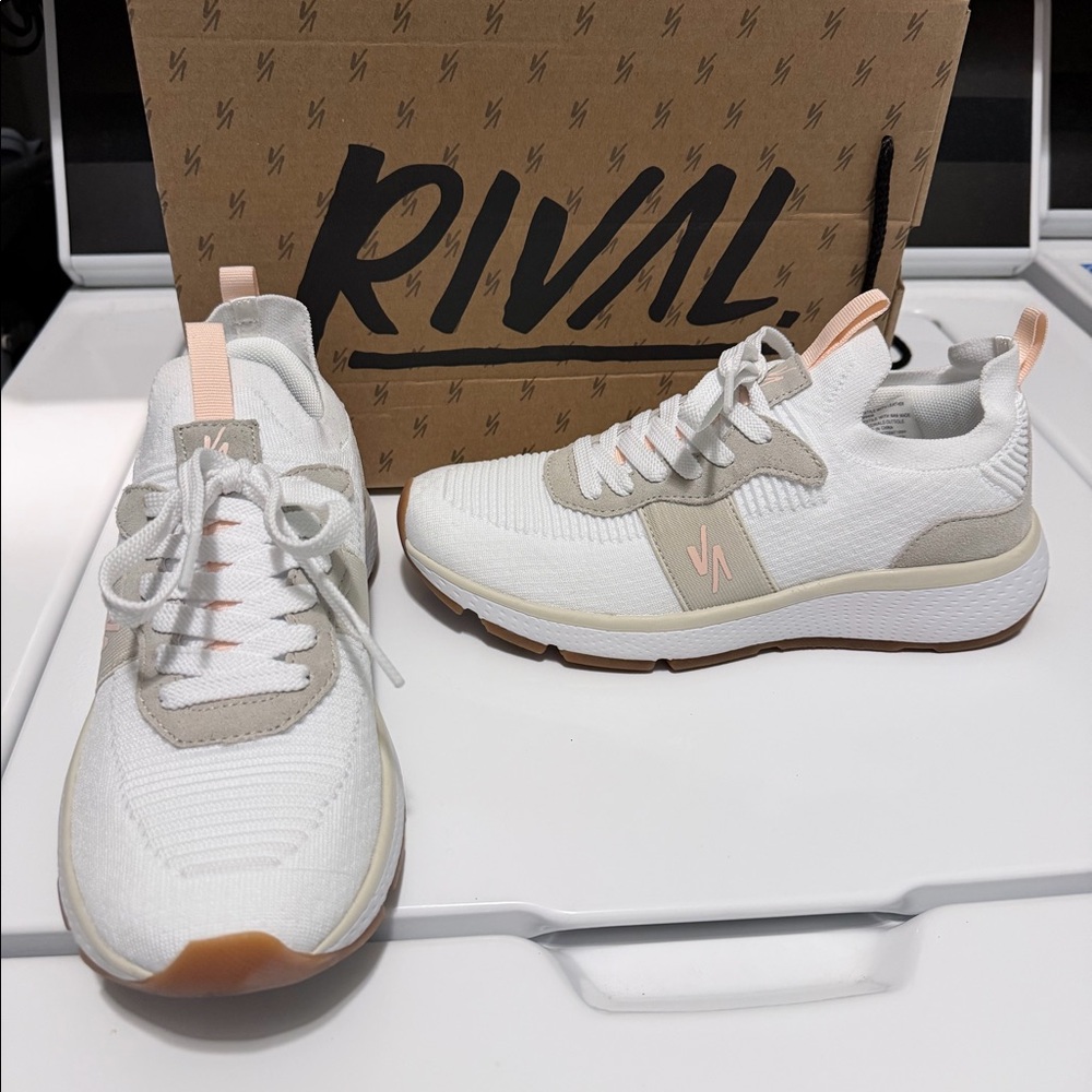 Women’s rival tennis shoe. White, light tan, and a little pale pink